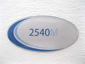 Booth Medical - Door Label, Blue Oval Tuttnauer Autoclave Part: LAB048-0295
